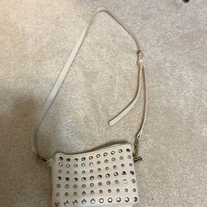 This is a good studded clutch crossbody bag.